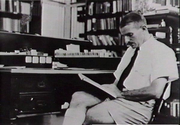 Unidentified man in office reading