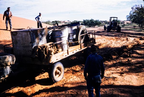 The grader towing bogged trailer