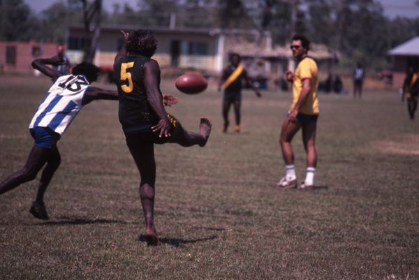 Kicking a football
