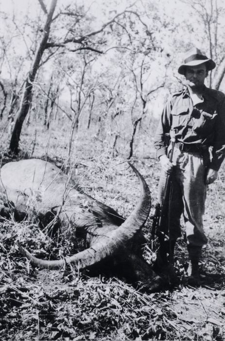 William (Bill) Dunstan stands next to a dead buffalo