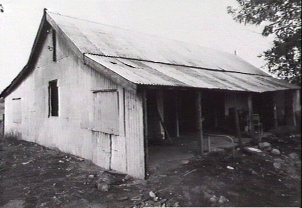 Ground level corrugated iron house