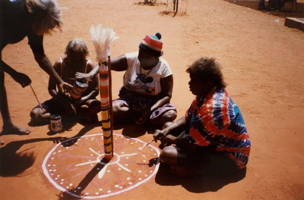 Group of women demonstrating bush tradition.